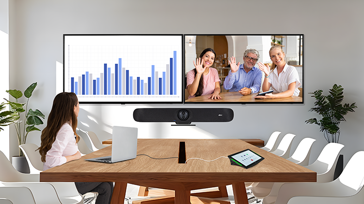 A woman in a meeting using a all-in-one conferencing system