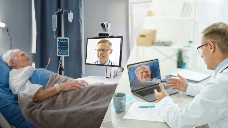 An elderly patient laying on a hospital bed, communicating with a doctor through a telemedicine cart with a telehealth camera and screen that allows the patient to see the doctor.