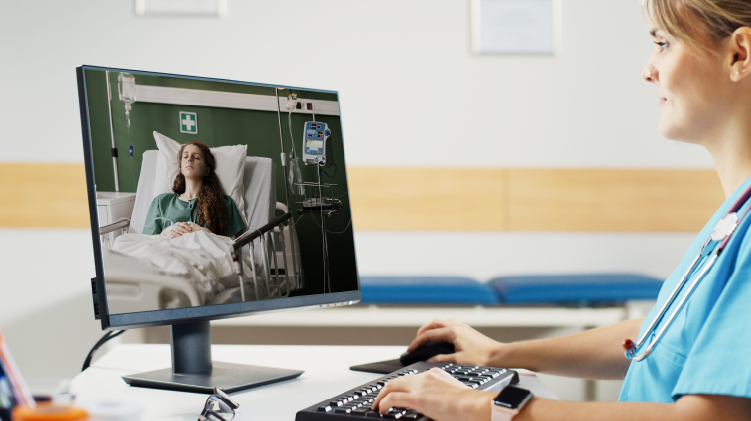 A nurse using visual confirmation to check on patient